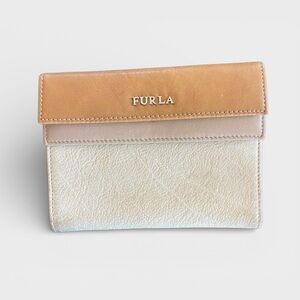 FURLA Leather Double Snap Two
Tone Wallet featuring classic neutral colors.
